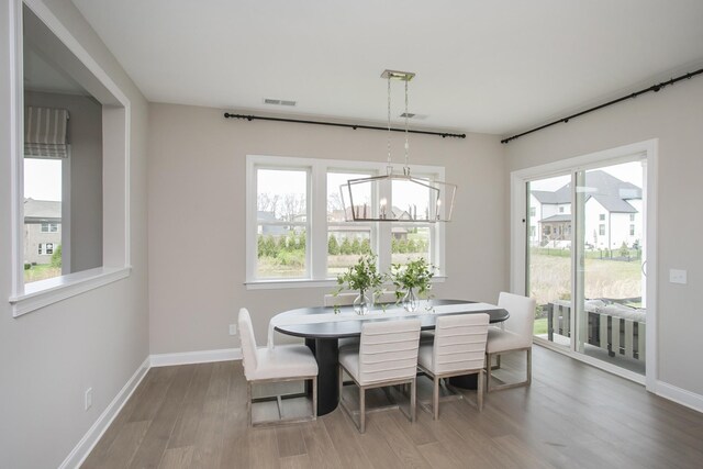 5969 Hunt Valley Dr, Spring Hill, TN 37174 - dining area featuring wood finished floors and a chandelier