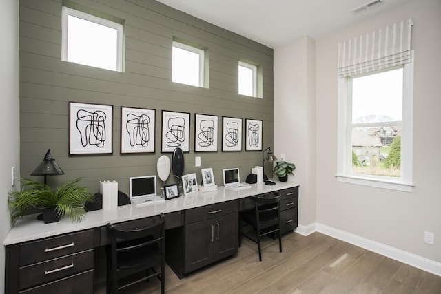 5969 Hunt Valley Dr, Spring Hill, TN 37174 - home office with built in study area, healthy amount of natural light, and light wood-style floors