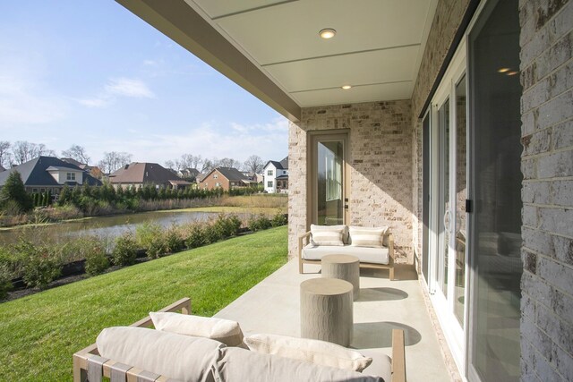 5955 Hunt Valley Dr, Spring Hill, TN 37174 - view of patio / terrace with a residential view and a water view