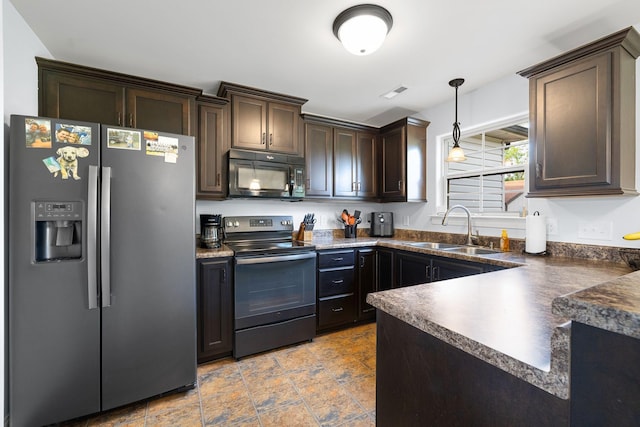 3228 Marion Davis Dr, Murfreesboro, TN 37129 - kitchen with stainless steel appliances, dark countertops, dark brown cabinetry, and decorative light fixtures