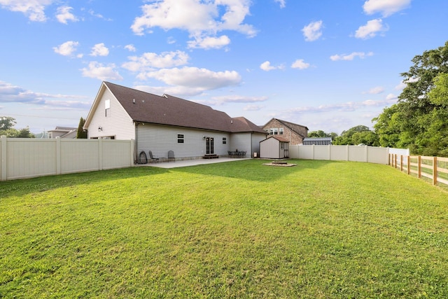3228 Marion Davis Dr, Murfreesboro, TN 37129 - rear view of house with a patio area, a storage unit, a fenced backyard, and a shingled roof