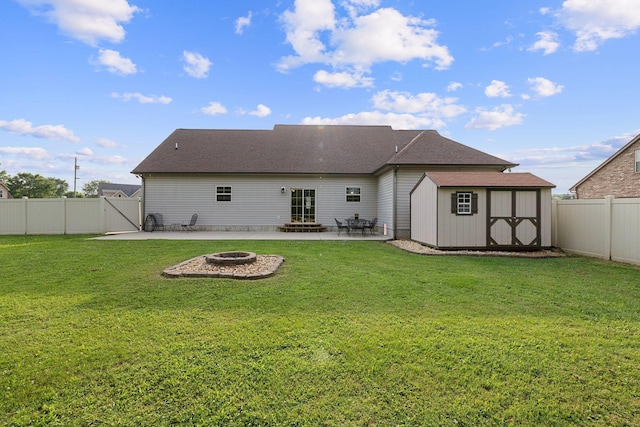 3228 Marion Davis Dr, Murfreesboro, TN 37129 - rear view of property featuring a patio, a fire pit, a storage shed, a fenced backyard, and a gate