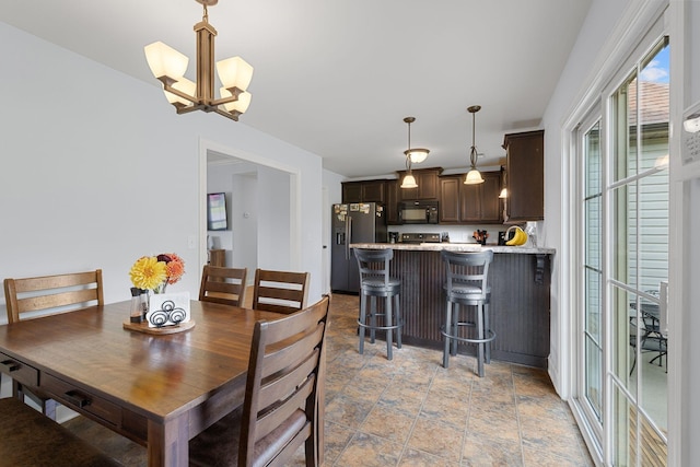 3228 Marion Davis Dr, Murfreesboro, TN 37129 - dining space with light stone finish floors and a chandelier
