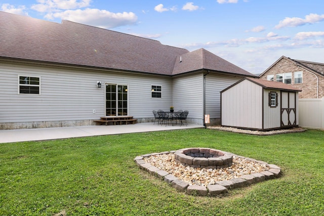 3228 Marion Davis Dr, Murfreesboro, TN 37129 - rear view of property featuring a patio area, a shed, an outdoor fire pit, and roof with shingles