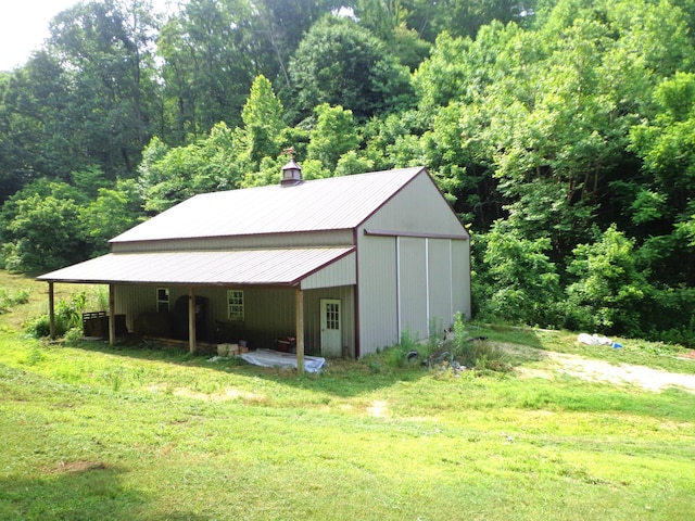 1342 Russell Creek Rd, Lobelville, TN 37097 - view of outbuilding with a wooded view