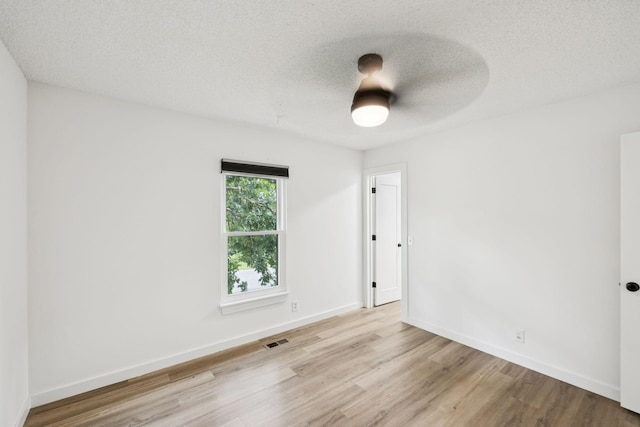 3345 Towneship Rd, Antioch, TN 37013 - unfurnished room with wood finished floors and a textured ceiling