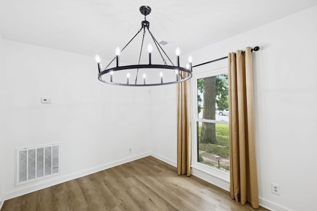 3345 Towneship Rd, Antioch, TN 37013 - unfurnished dining area featuring a chandelier and wood finished floors