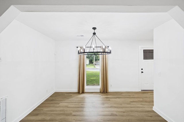 3345 Towneship Rd, Antioch, TN 37013 - unfurnished dining area with a chandelier and wood finished floors