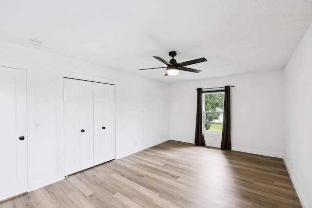 3345 Towneship Rd, Antioch, TN 37013 - unfurnished bedroom featuring light wood-style flooring, a closet, and a ceiling fan