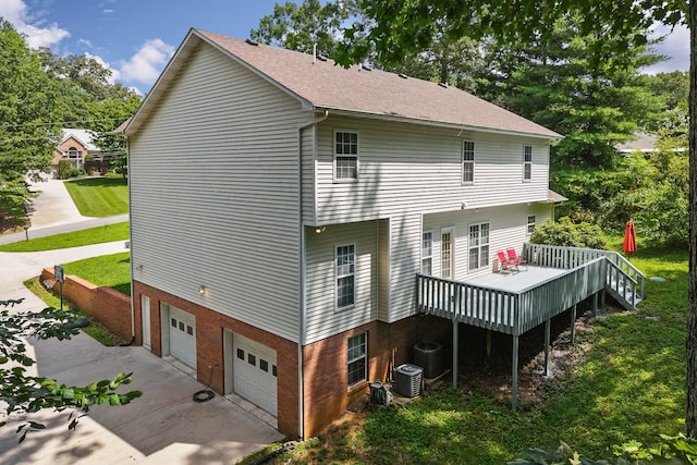 237 Windsor Dr, Cookeville, TN 38506 - view of side of property featuring a garage, driveway, a deck, brick siding, and roof with shingles