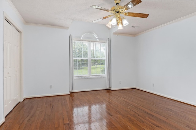 237 Windsor Dr, Cookeville, TN 38506 - unfurnished bedroom featuring hardwood / wood-style flooring, ornamental molding, a textured ceiling, and a ceiling fan
