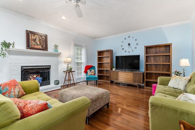 237 Windsor Dr, Cookeville, TN 38506 - living room featuring ceiling fan, crown molding, wood finished floors, a textured ceiling, and a brick fireplace