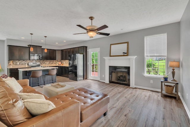 147 N Shadowhaven Way, Hendersonville, TN 37075 - living area featuring healthy amount of natural light, a ceiling fan, light wood finished floors, and recessed lighting