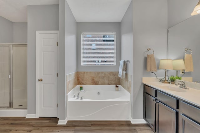 147 N Shadowhaven Way, Hendersonville, TN 37075 - bathroom with vanity, a bath, a stall shower, and wood finished floors
