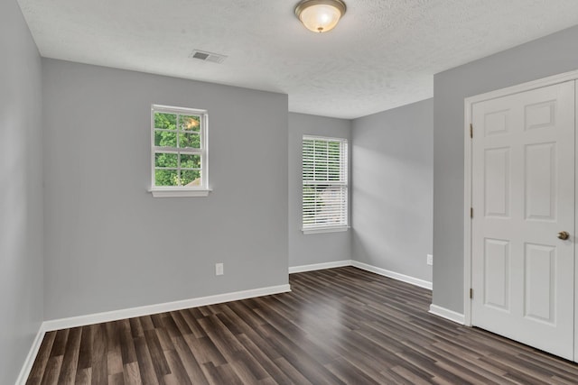 147 N Shadowhaven Way, Hendersonville, TN 37075 - unfurnished room with healthy amount of natural light, dark wood-type flooring, and a textured ceiling