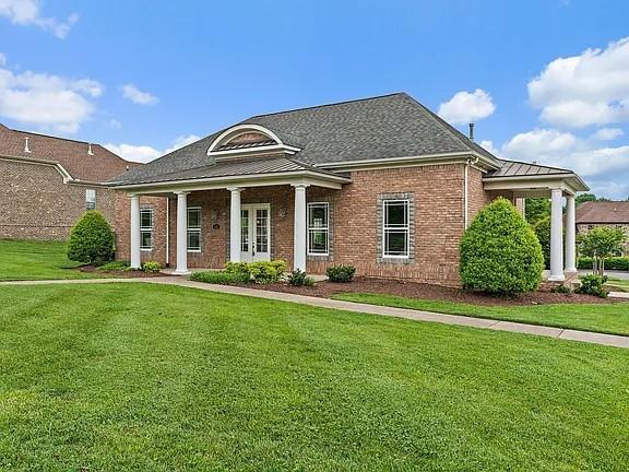 147 N Shadowhaven Way, Hendersonville, TN 37075 - neoclassical / greek revival house featuring a front yard and brick siding