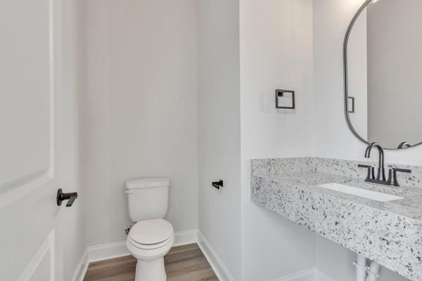 179 Charleston Ave, Pleasant View, TN 37146 - half bath featuring a sink and wood finished floors