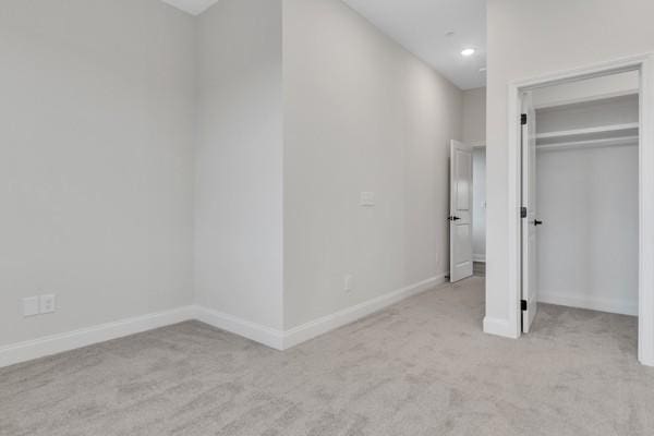 179 Charleston Ave, Pleasant View, TN 37146 - unfurnished bedroom featuring light carpet, a closet, and recessed lighting