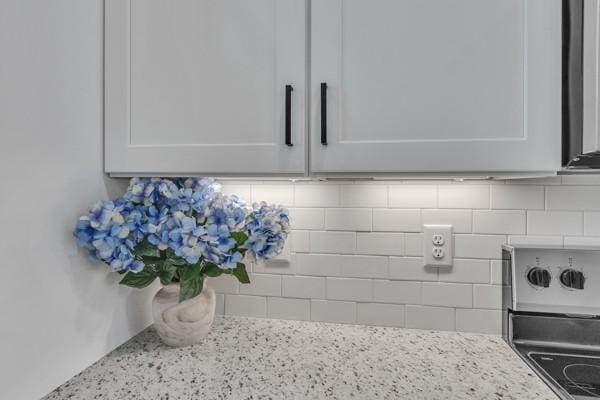 179 Charleston Ave, Pleasant View, TN 37146 - kitchen view of range, light stone countertops, and white cabinets