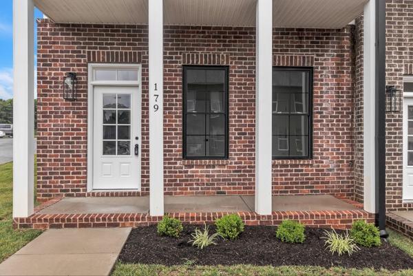 179 Charleston Ave, Pleasant View, TN 37146 - view of exterior entry with brick siding and a porch