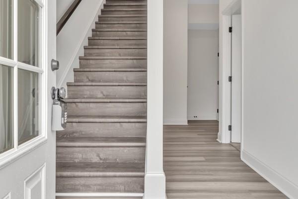 183 Charleston Ave, Pleasant View, TN 37146 - stairs with wood finished floors and baseboards