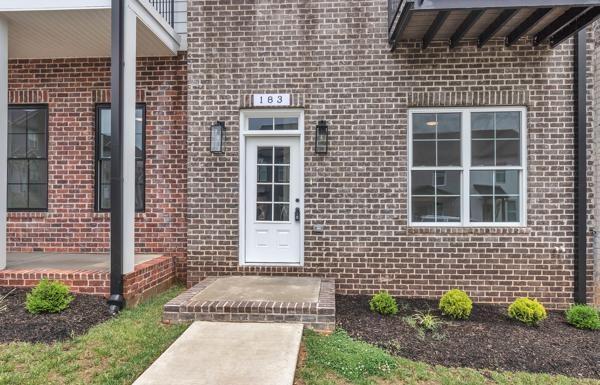 183 Charleston Ave, Pleasant View, TN 37146 - doorway to property with brick siding