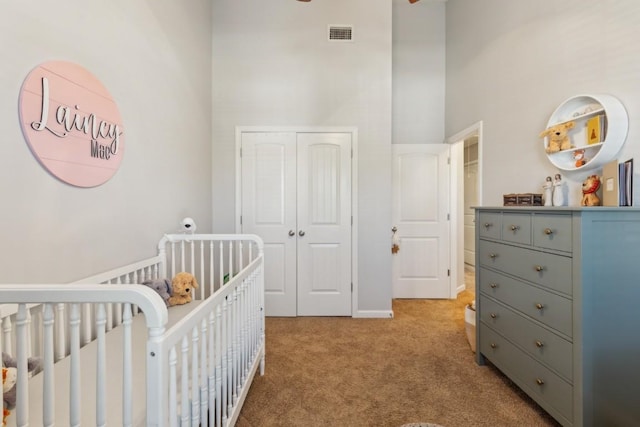2058 Caladonia Way, Smyrna, TN 37167 - bedroom with a towering ceiling, light carpet, a crib, and a closet