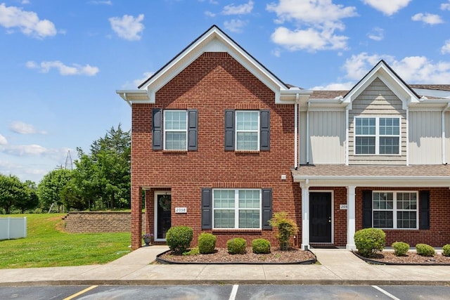 2058 Caladonia Way, Smyrna, TN 37167 - multi unit property featuring brick siding, uncovered parking, board and batten siding, and a front lawn