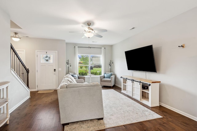 717 Monarchos Bnd, Burns, TN 37029 - living room featuring stairway, ceiling fan, and dark wood-style floors