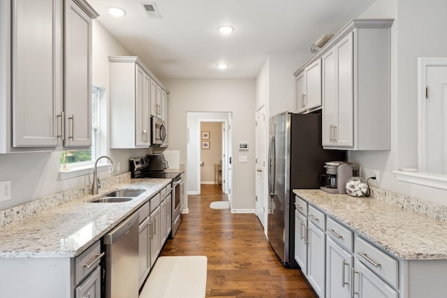 717 Monarchos Bnd, Burns, TN 37029 - kitchen featuring stainless steel appliances, dark wood finished floors, recessed lighting, and light stone countertops