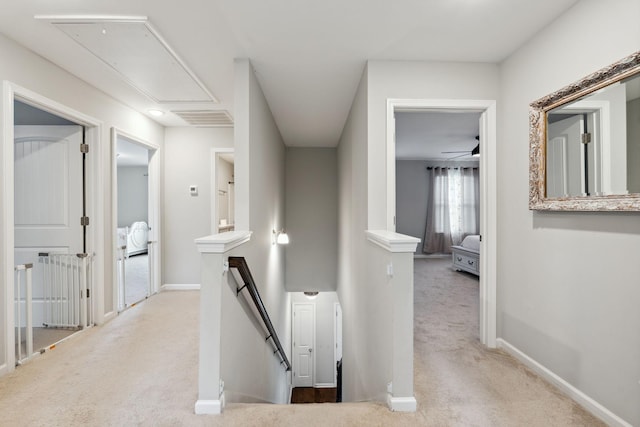 717 Monarchos Bnd, Burns, TN 37029 - hallway featuring attic access, an upstairs landing, and carpet