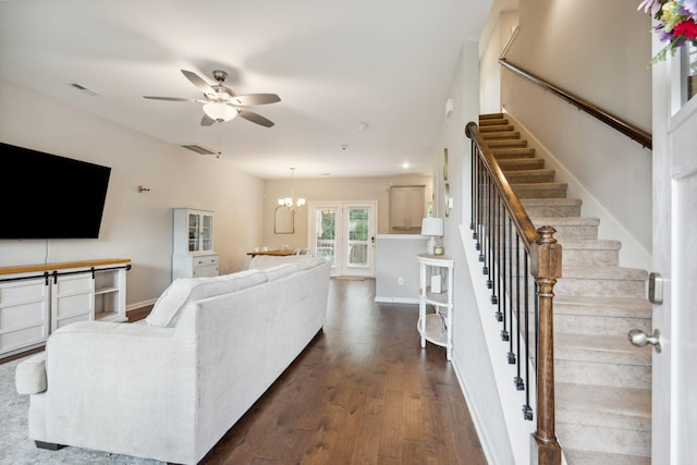 717 Monarchos Bnd, Burns, TN 37029 - living area with ceiling fan, stairs, dark wood-style floors, and a chandelier