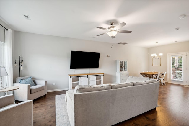717 Monarchos Bnd, Burns, TN 37029 - living room with a chandelier, a ceiling fan, and dark wood-style flooring