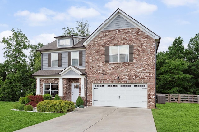 717 Monarchos Bnd, Burns, TN 37029 - view of front facade with a garage, driveway, brick siding, and a shingled roof