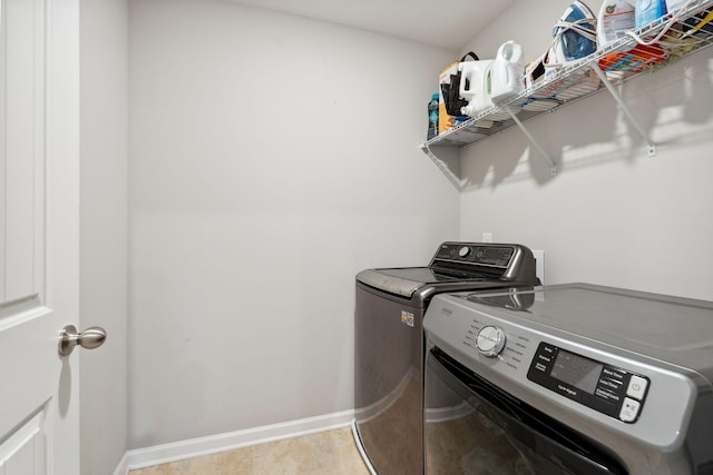 717 Monarchos Bnd, Burns, TN 37029 - laundry area featuring separate washer and dryer and baseboards