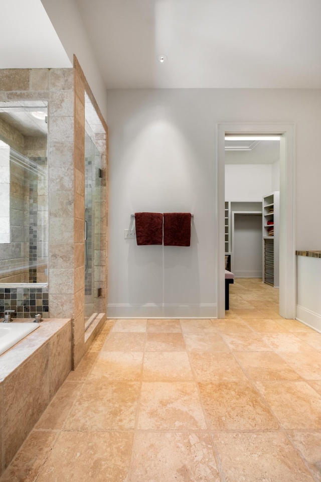 7909 Shoals Branch Rd, Primm Springs, TN 38476 - full bathroom with a shower stall, a bath, a walk in closet, and tile patterned flooring