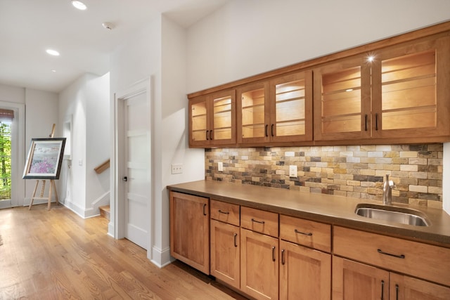 7909 Shoals Branch Rd, Primm Springs, TN 38476 - indoor wet bar featuring backsplash, light wood-style floors, recessed lighting, and stairway
