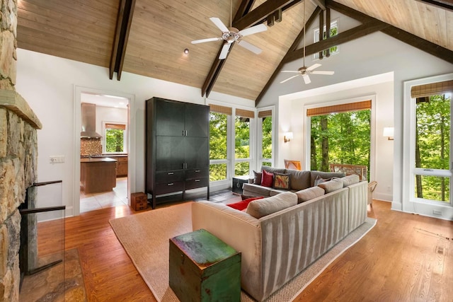 7909 Shoals Branch Rd, Primm Springs, TN 38476 - living room with a ceiling fan, high vaulted ceiling, light wood-type flooring, and a wood ceiling with exposed beams