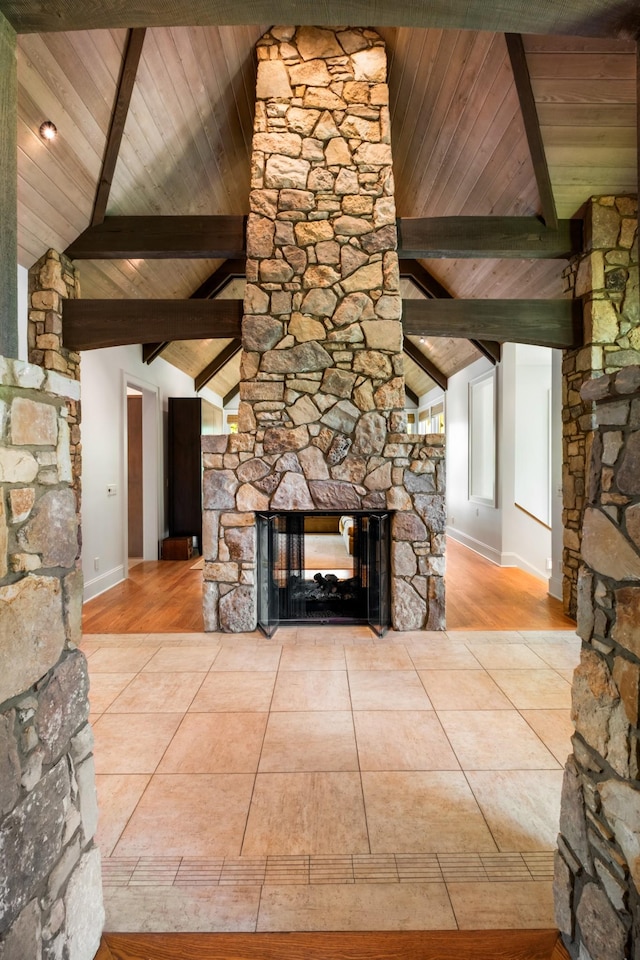 7909 Shoals Branch Rd, Primm Springs, TN 38476 - unfurnished living room with wood ceiling, a stone fireplace, and wood finished floors