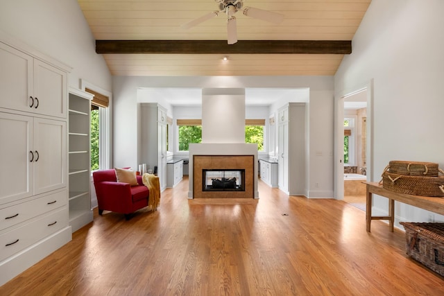 7909 Shoals Branch Rd, Primm Springs, TN 38476 - living room with a tile fireplace, light wood finished floors, and a ceiling fan