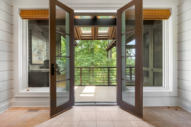 7909 Shoals Branch Rd, Primm Springs, TN 38476 - doorway to outside featuring french doors, plenty of natural light, and light tile patterned floors