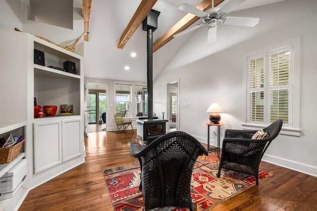 7909 Shoals Branch Rd, Primm Springs, TN 38476 - living area featuring a wood stove, beam ceiling, dark wood-style floors, ceiling fan, and recessed lighting