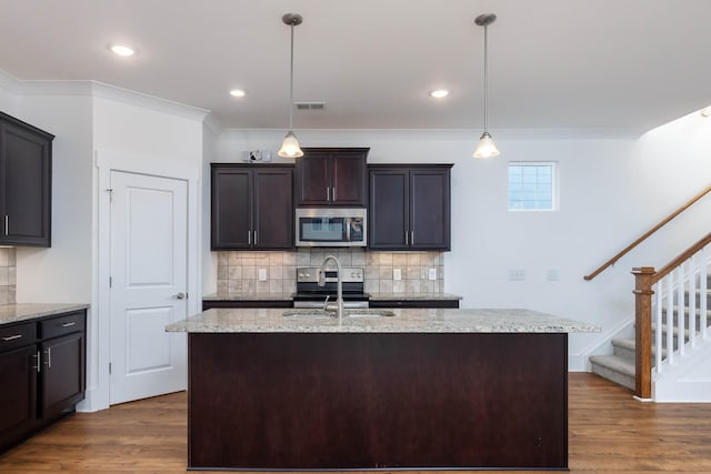6055 Gracious Dr, Franklin, TN 37064 - kitchen with stainless steel appliances, dark wood finished floors, tasteful backsplash, pendant lighting, and recessed lighting