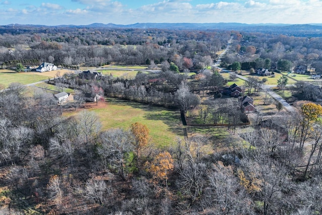 6055 Gracious Dr, Franklin, TN 37064 - aerial view of property's location featuring a heavily wooded area and a mountainous background