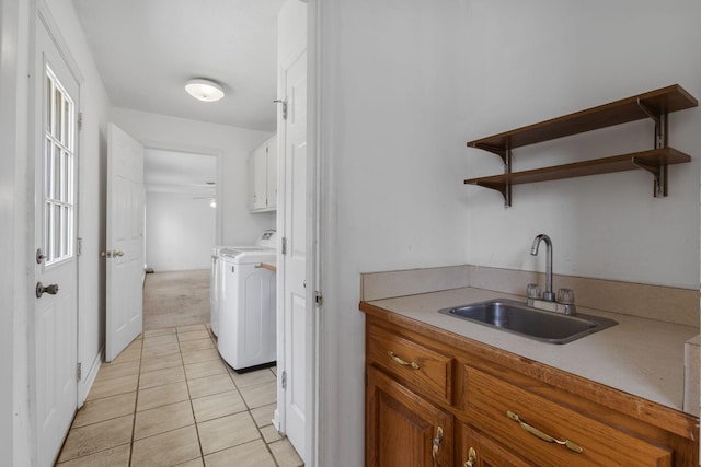 772 Blakemore Rd, Dickson, TN 37055 - washroom with cabinet space, independent washer and dryer, light tile patterned floors, ceiling fan, and light colored carpet