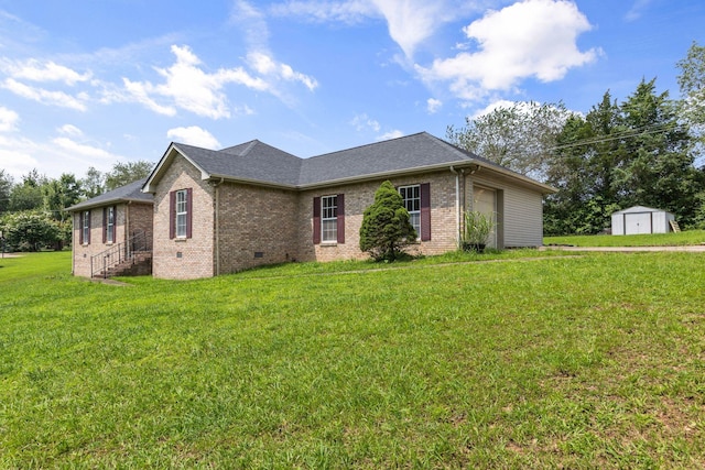 772 Blakemore Rd, Dickson, TN 37055 - view of property exterior featuring brick siding, a shed, a lawn, crawl space, and roof with shingles