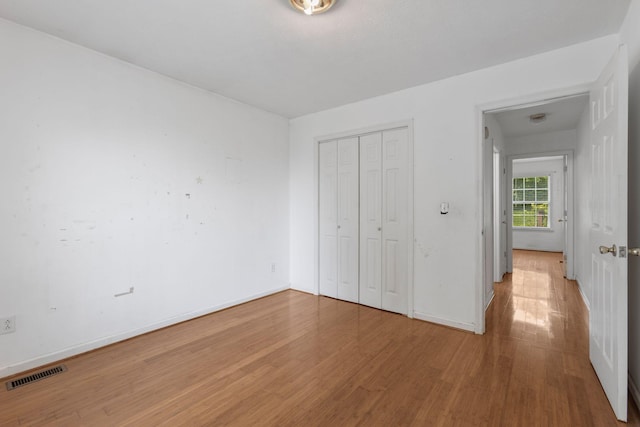 772 Blakemore Rd, Dickson, TN 37055 - unfurnished bedroom featuring wood finished floors and a closet