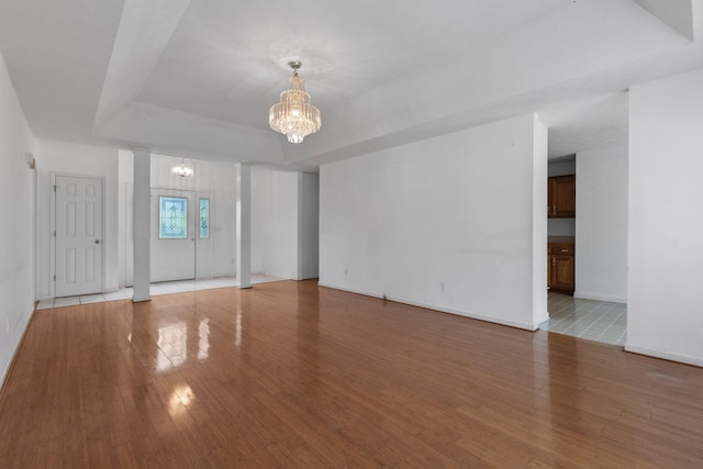 772 Blakemore Rd, Dickson, TN 37055 - unfurnished room featuring a chandelier, a tray ceiling, and light wood finished floors
