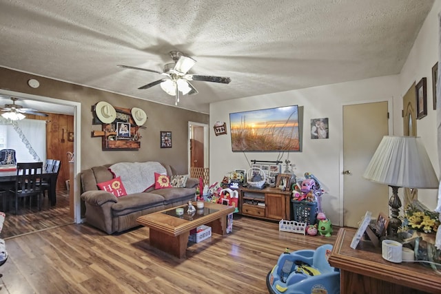 117 Hill Rd, Ardmore, TN 38449 - living area with ceiling fan, wood finished floors, and a textured ceiling