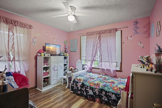 117 Hill Rd, Ardmore, TN 38449 - bedroom with wood finished floors, a textured ceiling, and ceiling fan